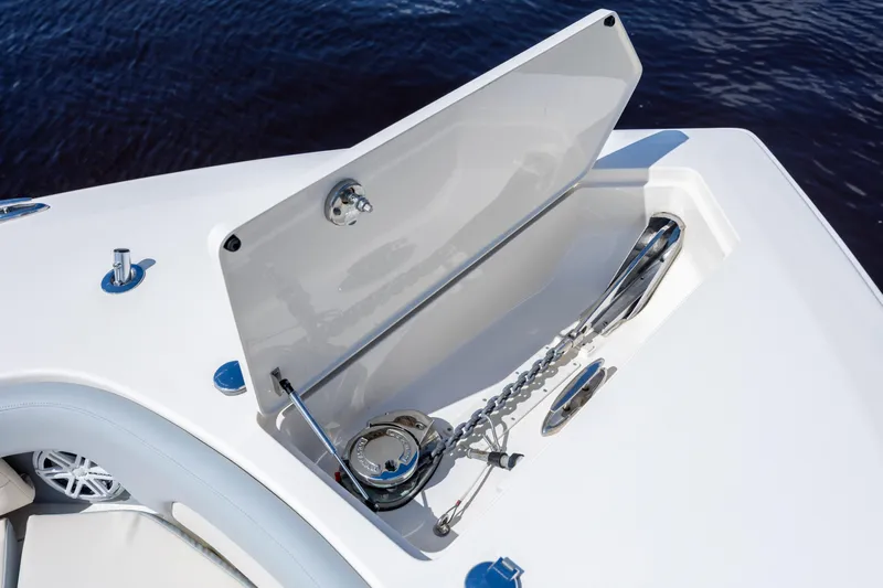  Yacht Photos Pics 2019 Scout 420 LXF boat anchor compartment with open hatch, showcasing marine hardware.