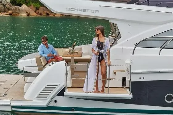  Yacht Photos Pics Couple enjoying a luxurious day on a 2026 Schaefer 510 GT Pininfarina yacht.
