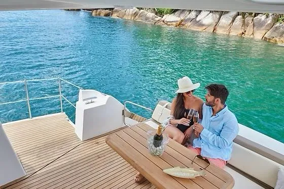  Yacht Photos Pics Couple enjoying a romantic moment on a 2026 Schaefer 510 GT Pininfarina yacht.