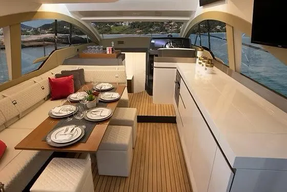  Yacht Photos Pics Luxurious interior of 2026 Schaefer 510 GT Pininfarina yacht with elegant dining area.