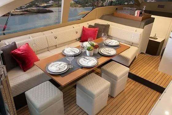  Yacht Photos Pics Luxurious dining area on 2026 Schaefer 510 GT Pininfarina yacht with elegant table setting.