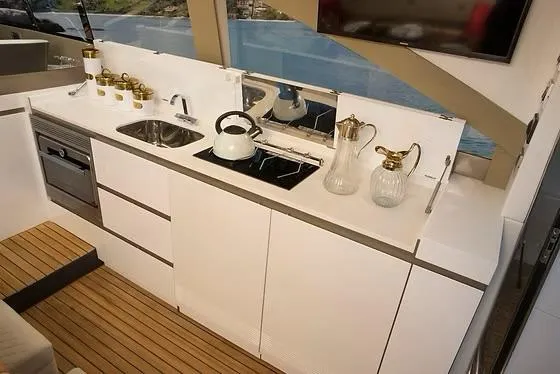  Yacht Photos Pics Modern kitchen interior on 2026 Schaefer 510 GT Pininfarina yacht with sleek design and appliances.