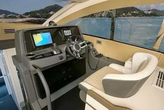  Yacht Photos Pics Interior of 2026 Schaefer 510 GT Pininfarina yacht with modern helm and scenic view.