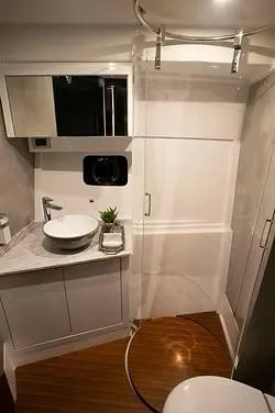  Yacht Photos Pics Luxurious bathroom in 2026 Schaefer 510 GT Pininfarina yacht with modern fixtures and elegant design.