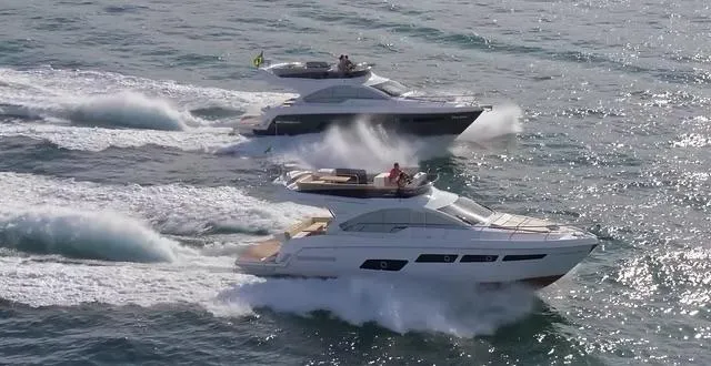  Yacht Photos Pics Two Schaefer 510 GT Pininfarina yachts cruising on the ocean, 2026 model.