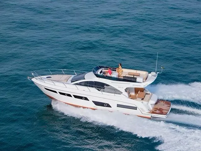  Yacht Photos Pics 2026 Schaefer 510 GT Pininfarina yacht cruising on open sea, showcasing sleek design and luxury.
