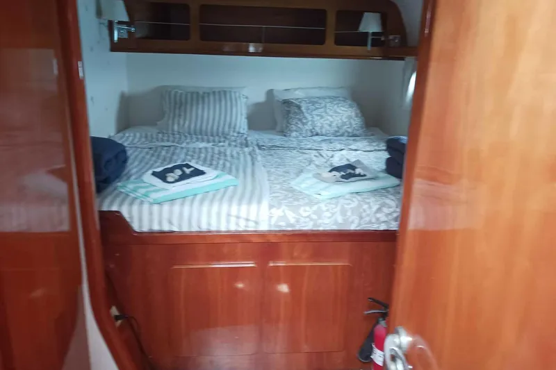 Macera Yacht Photos Pics Luxurious cabin interior of 2008 Privilege 495 yacht with neatly arranged bedding.