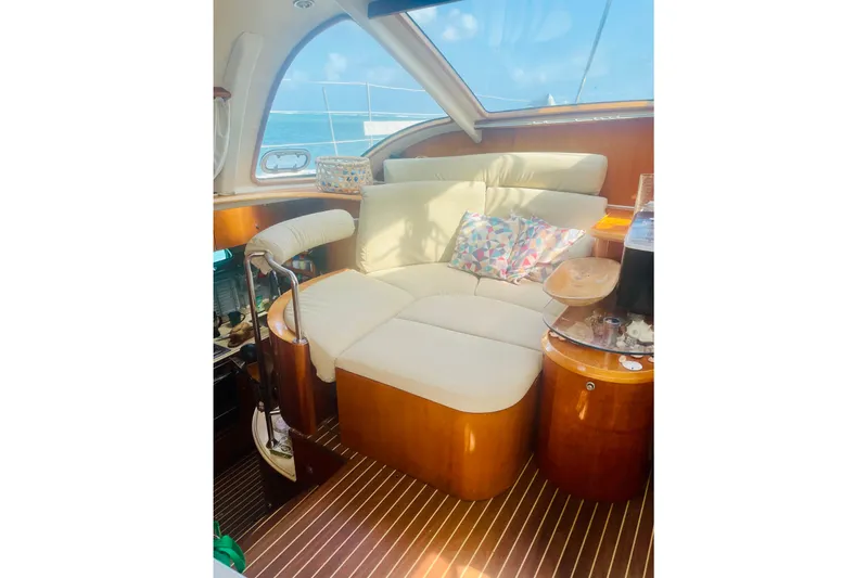 Macera Yacht Photos Pics Luxurious interior of 2008 Privilege 495 yacht with plush seating and elegant wood finish.