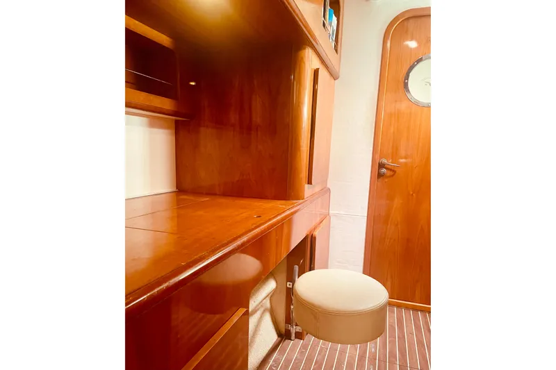 Macera Yacht Photos Pics Luxurious wooden interior of 2008 Privilege 495 yacht with seating and door.