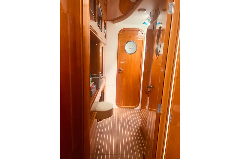 Macera Yacht Photos Pics Interior of 2008 Privilege 495 yacht with polished wood finish and nautical decor.