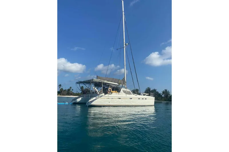 Macera Yacht Photos Pics Sailing catamaran Privilege 495, 2008 model, anchored in calm tropical waters.