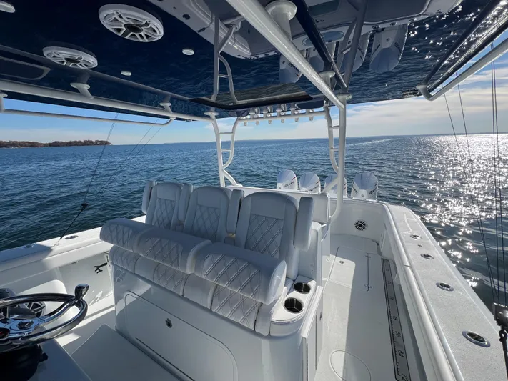  Yacht Photos Pics 2023 Yellowfin 42 Offshore boat interior with luxurious seating on open water.