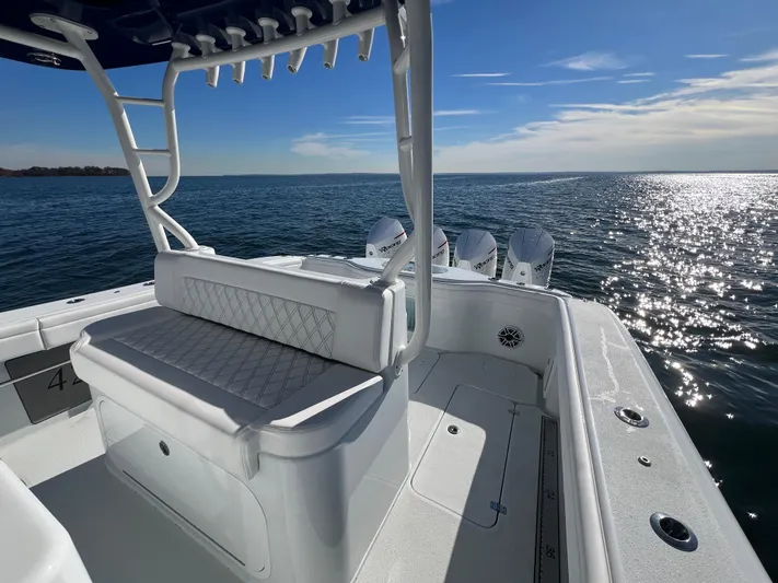  Yacht Photos Pics 2023 Yellowfin 42 Offshore boat on open water, featuring sleek design and powerful engines.