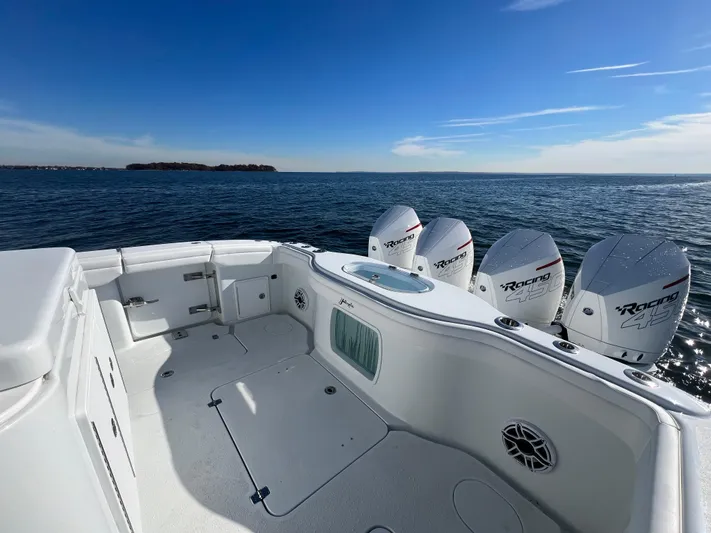  Yacht Photos Pics 2023 Yellowfin 42 Offshore boat with powerful engines on open water.