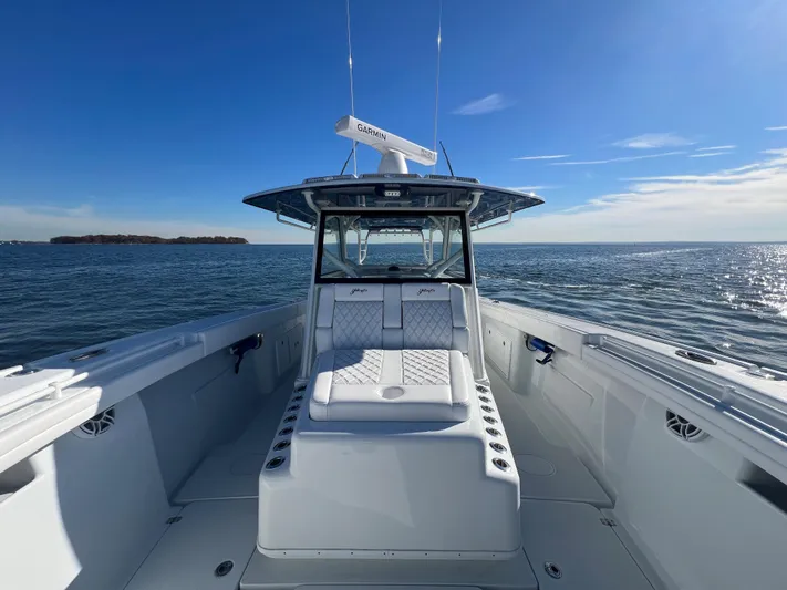  Yacht Photos Pics 2023 Yellowfin 42 Offshore boat on open water, clear sky, luxurious seating.