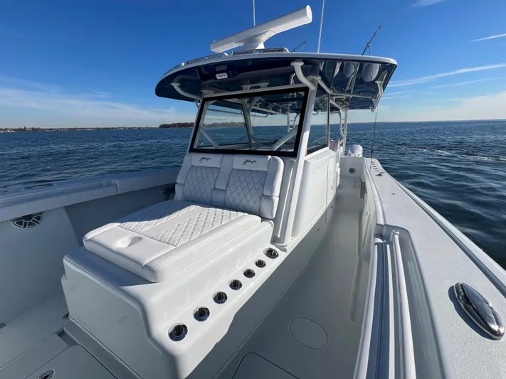  Yacht Photos Pics 2023 Yellowfin 42 Offshore boat on open water, featuring sleek design and spacious deck.