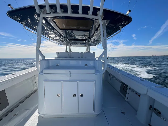  Yacht Photos Pics 2023 Yellowfin 42 Offshore boat interior with ocean view and clear blue sky.