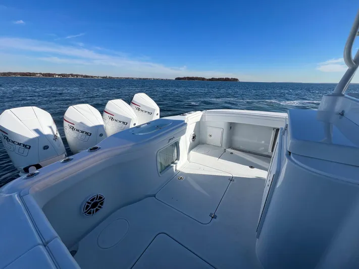  Yacht Photos Pics 2023 Yellowfin 42 Offshore boat with multiple outboard engines on open water.