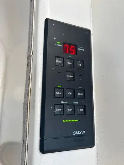  Yacht Photos Pics Control panel of a 1995 Lagoon TPI 37 boat, displaying temperature settings.