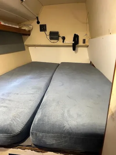  Yacht Photos Pics Interior cabin of 1995 Lagoon TPI 37 with twin beds and nautical equipment.