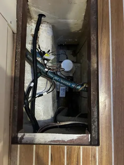  Yacht Photos Pics 1995 Lagoon TPI 37 yacht interior showing plumbing and wiring components.