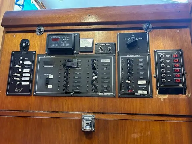  Yacht Photos Pics Control panel of a 1995 Lagoon TPI 37 yacht with various switches and gauges.