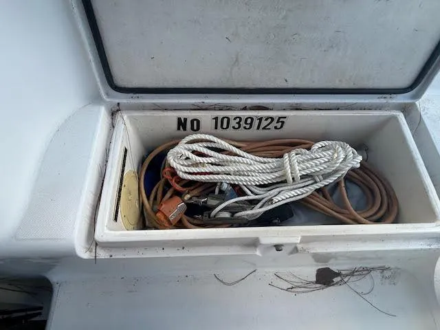  Yacht Photos Pics Storage compartment on a 1995 Lagoon TPI 37 with ropes and equipment.