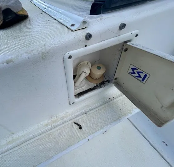  Yacht Photos Pics 1995 Lagoon TPI 37 boat compartment with open hatch and visible fittings.