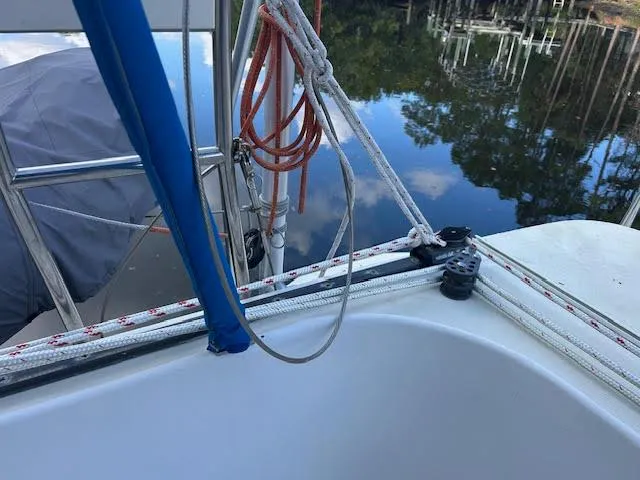  Yacht Photos Pics 1995 Lagoon TPI 37 sailboat deck with ropes and calm water reflection.
