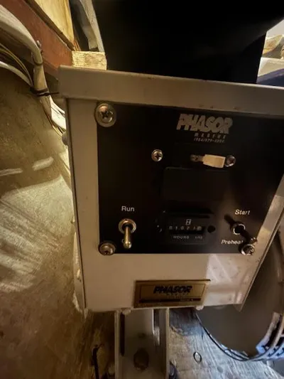  Yacht Photos Pics Control panel of a 1995 Lagoon TPI 37 boat with Phasor generator switches.