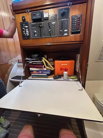  Yacht Photos Pics Control panel and storage area inside a 1995 Lagoon TPI 37 sailboat.