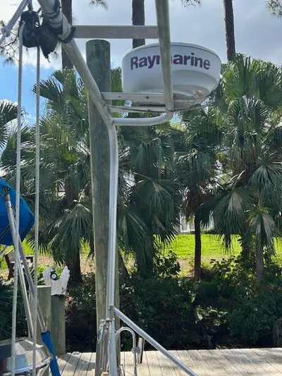  Yacht Photos Pics Radar equipment on a 1995 Lagoon TPI 37 sailboat, docked near palm trees.