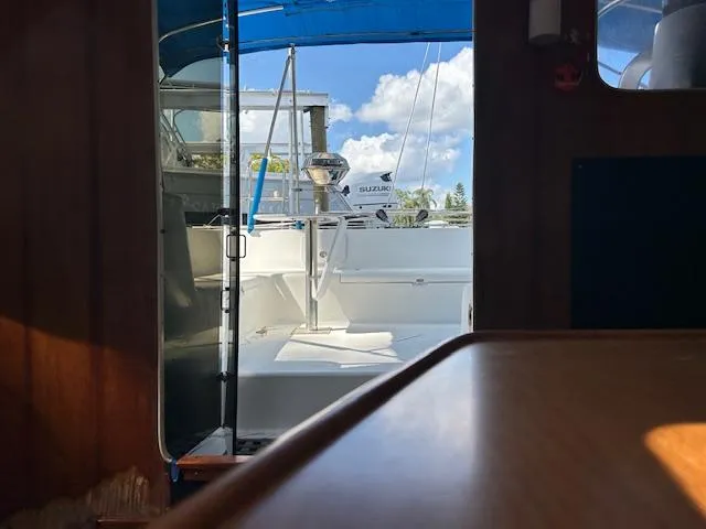  Yacht Photos Pics Interior view of 1995 Lagoon TPI 37 sailboat with open door to deck.