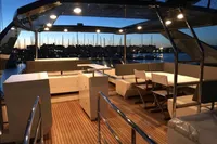 Luxurious Astondoa A76 GLX yacht deck at sunset, featuring elegant seating and modern design.
