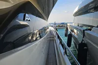 Side view of 2008 Astondoa A76 GLX yacht, upgraded to A80 GLX, docked at marina.