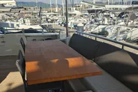 Outdoor seating on 2008 Astondoa A76 GLX yacht, upgraded to A80 GLX, in marina setting.