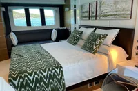 Luxurious bedroom interior on 2008 Astondoa A76 GLX yacht, featuring elegant decor and ocean view.