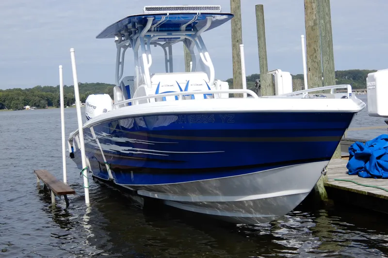  Yacht Photos Pics Blue 2021 Concept 32' Open Deck boat docked on calm water.