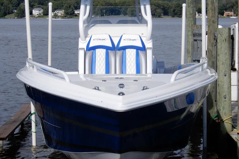  Yacht Photos Pics 2021 Concept 32' Open Deck boat docked on a calm lake.