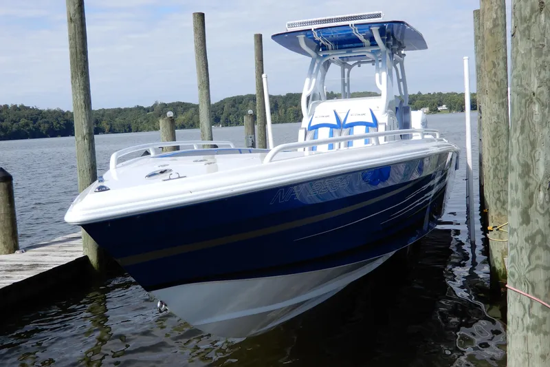  Yacht Photos Pics 2021 Concept 32' Open Deck boat docked on a serene lake.