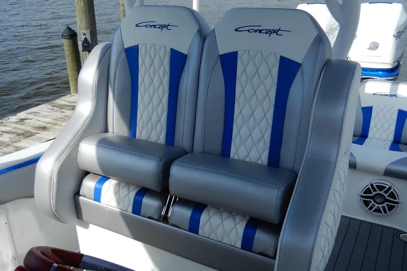  Yacht Photos Pics Luxury seating on 2021 Concept 32' Open Deck boat, featuring blue and white upholstery.