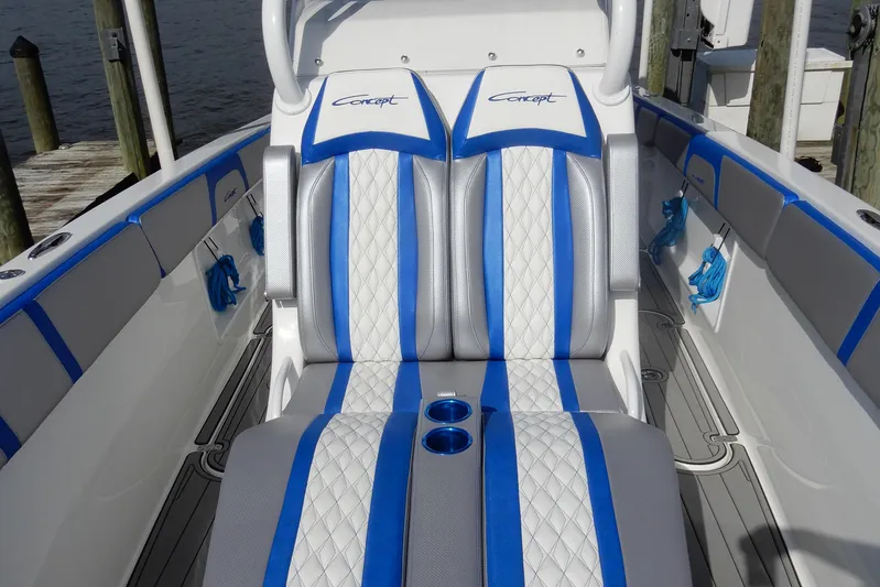  Yacht Photos Pics Luxury seating on 2021 Concept 32' Open Deck boat with blue and white upholstery.