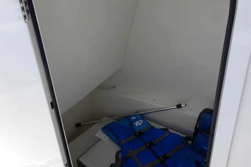 Yacht Photos Pics Storage compartment of 2021 Concept 32' Open Deck with life jackets and equipment.