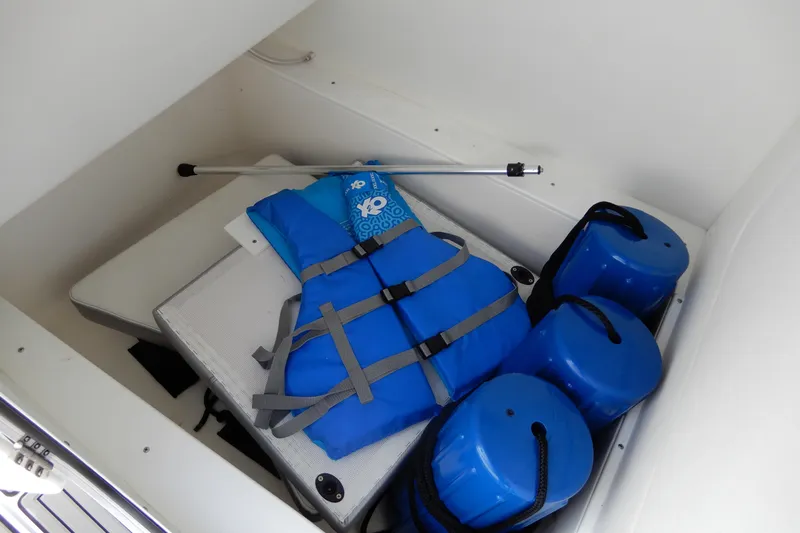  Yacht Photos Pics Storage compartment with blue life jacket and fenders on Concept 32' Open Deck boat.