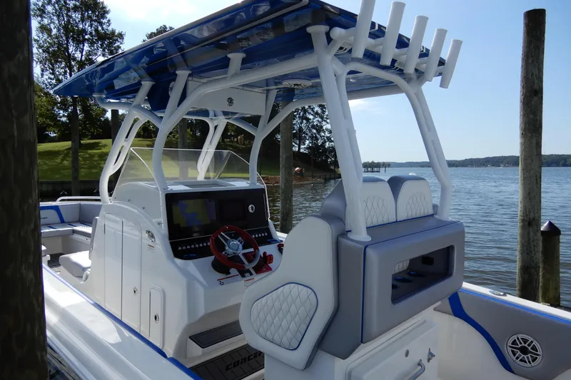  Yacht Photos Pics 2021 Concept 32' Open Deck boat with modern helm, docked by a scenic lake.