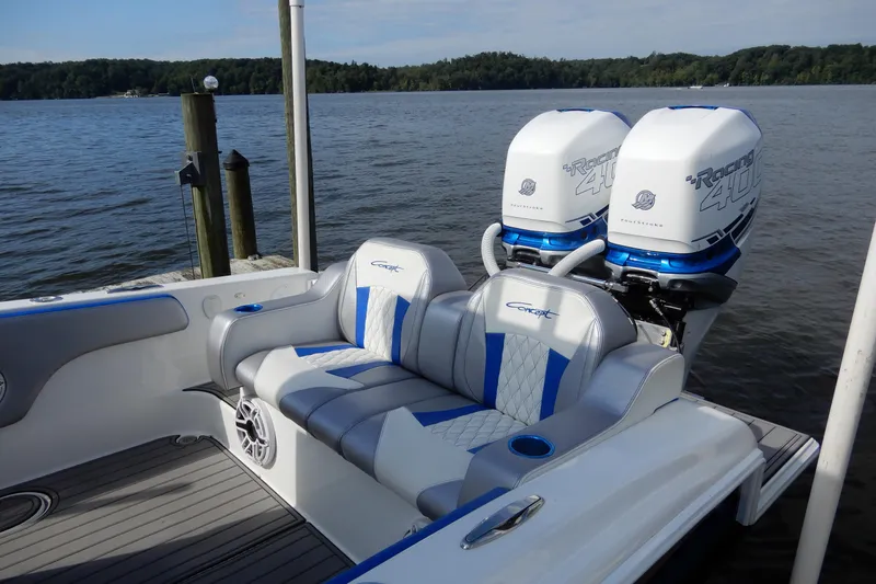  Yacht Photos Pics 2021 Concept 32' Open Deck boat with twin Racing 400 engines on a serene lake.