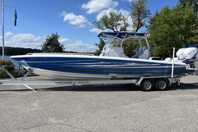  Yacht Photos Pics 2021 Concept 32' Open Deck boat on trailer, blue and white design, parked outdoors.