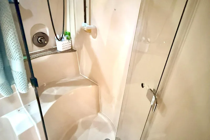 Creme Brulee Yacht Photos Pics 2001 Cruisers Yachts 4270 Express bathroom with glass shower door and modern fixtures.