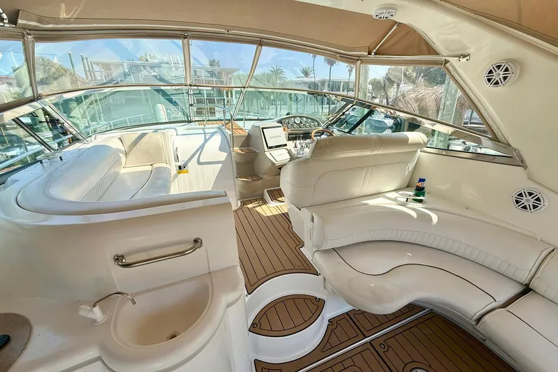 Creme Brulee Yacht Photos Pics 2001 Cruisers Yachts 4270 Express interior with luxurious seating and modern helm.