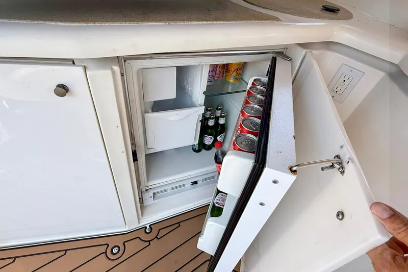 Creme Brulee Yacht Photos Pics Mini fridge stocked with drinks on a 2001 Cruisers Yachts 4270 Express boat.